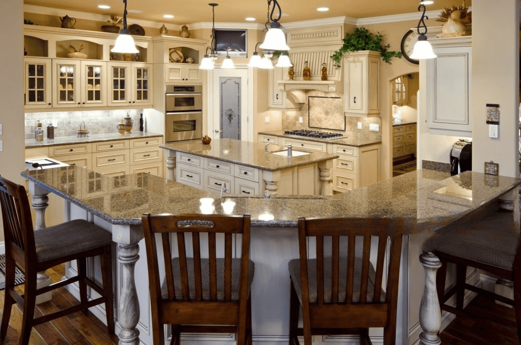 Elegant kitchen featuring durable granite countertops, island seating, and premium finishes